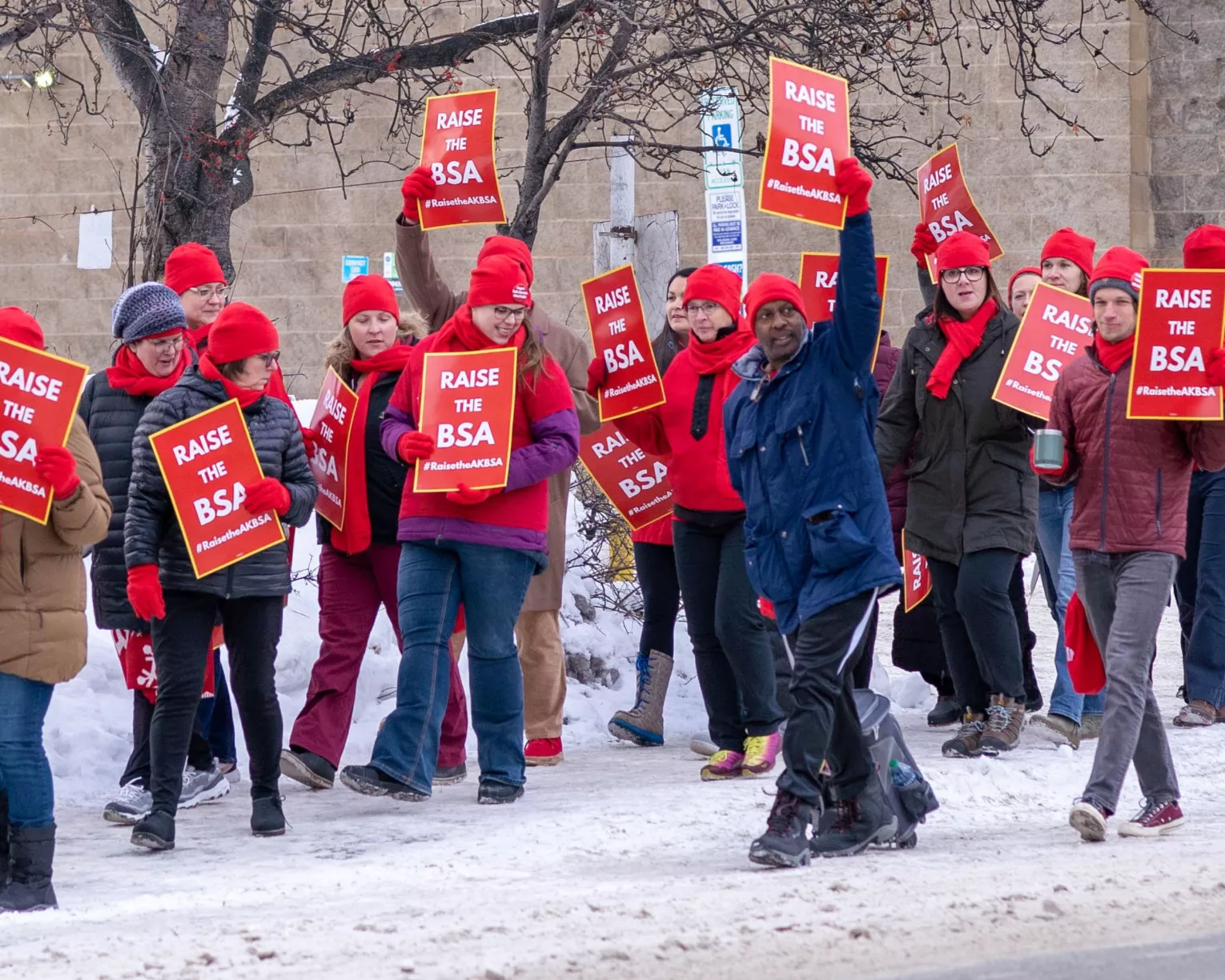 members marching for raise the bsa