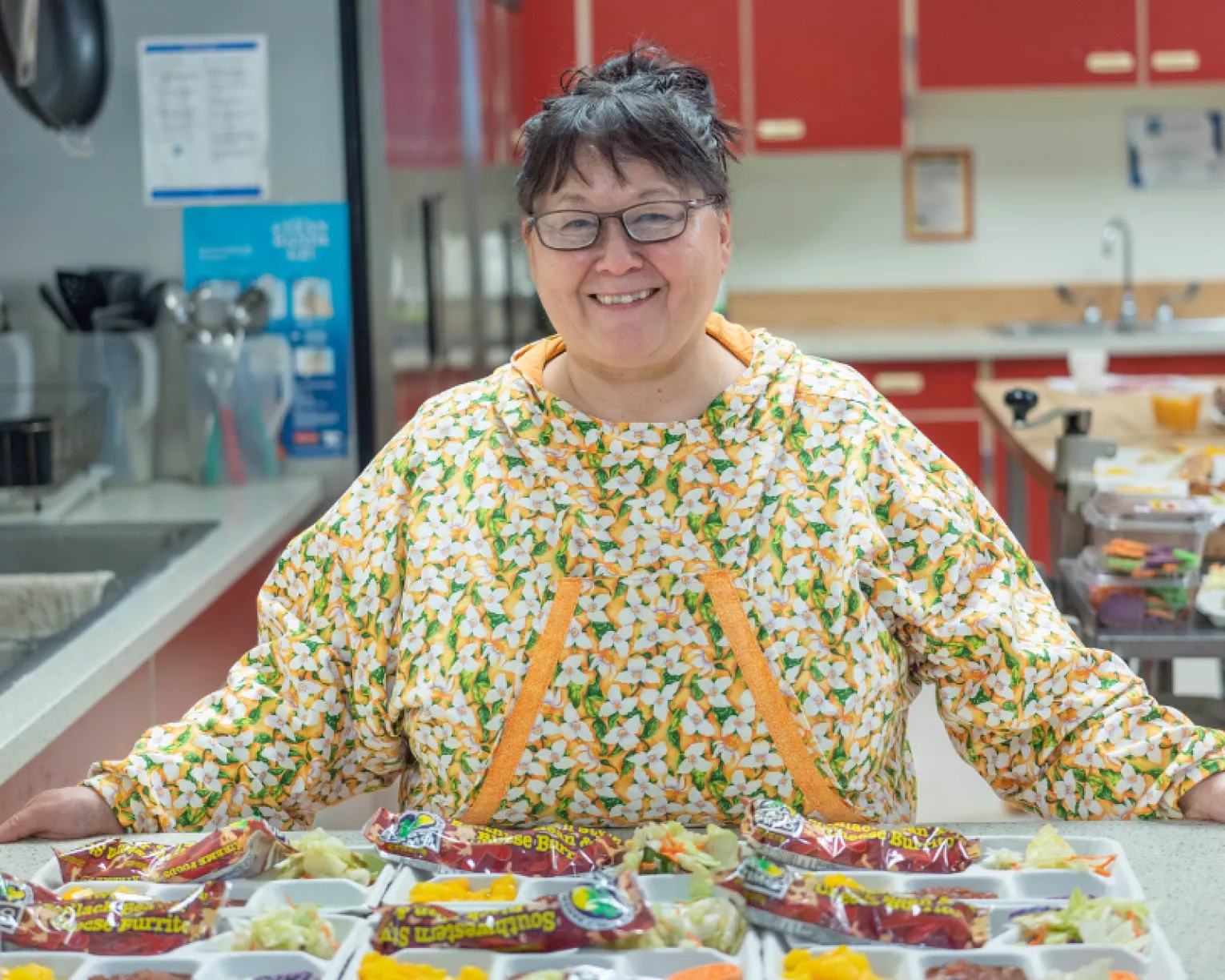 Phyllis Clough posing with her school lunches.
