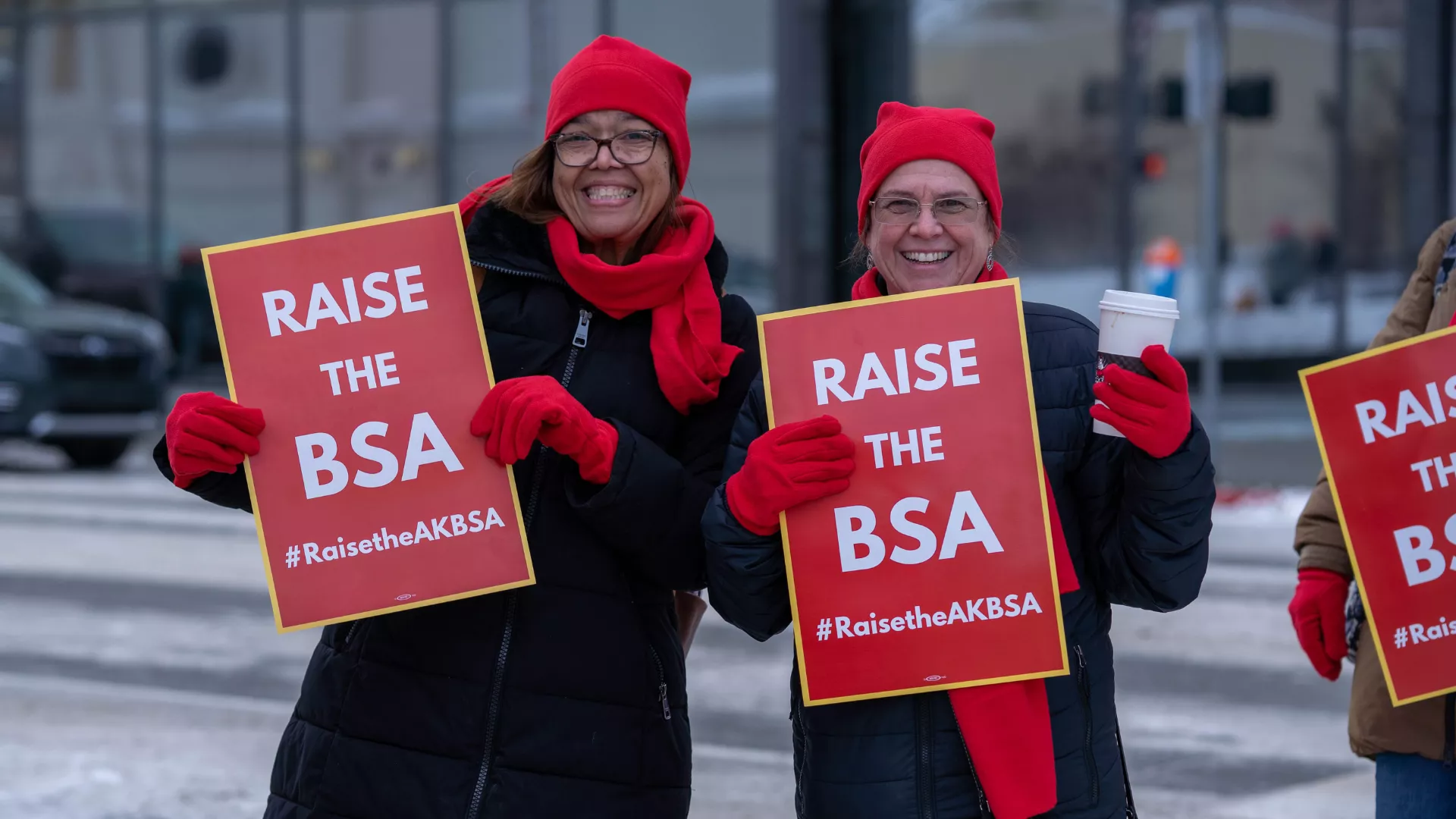 Educators pose with "Raise the BSA" rally signs