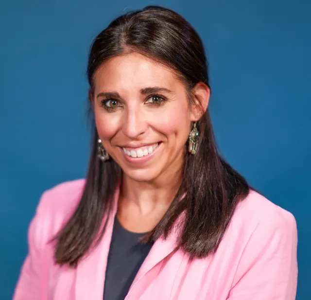 Portrait of Jenell Hartman wearing a pink blazer
