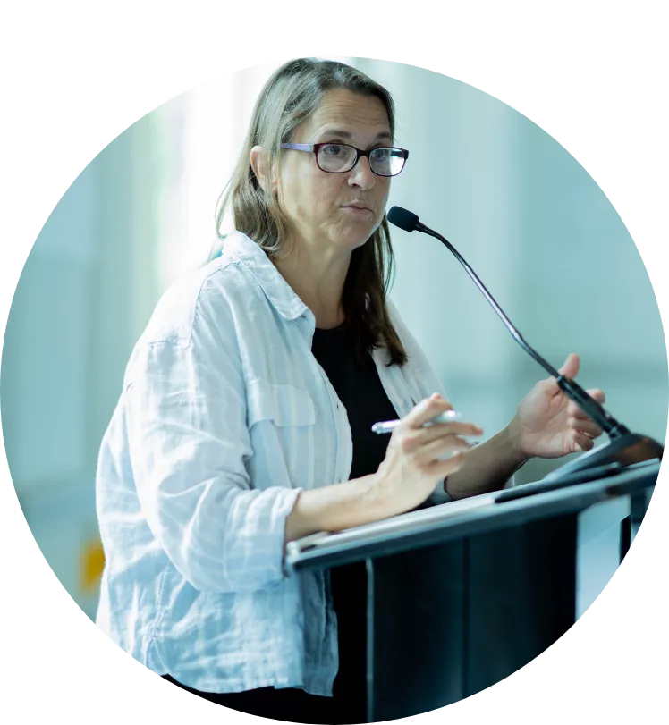 Laura Capelle speaks at a podium